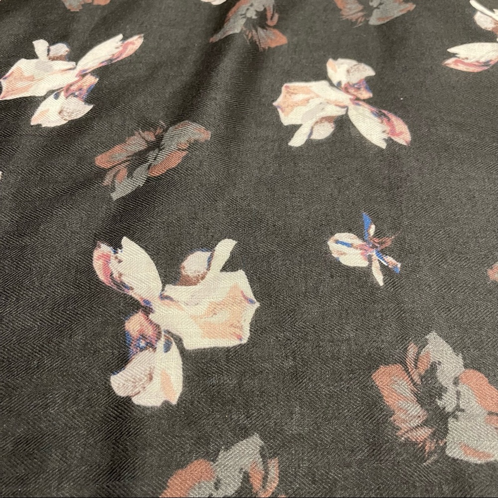 Beautiful scarf in black with some pinks and blues. Gorgeous